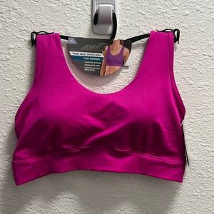 Avia women’s twist back sports bra in pink. Size XL